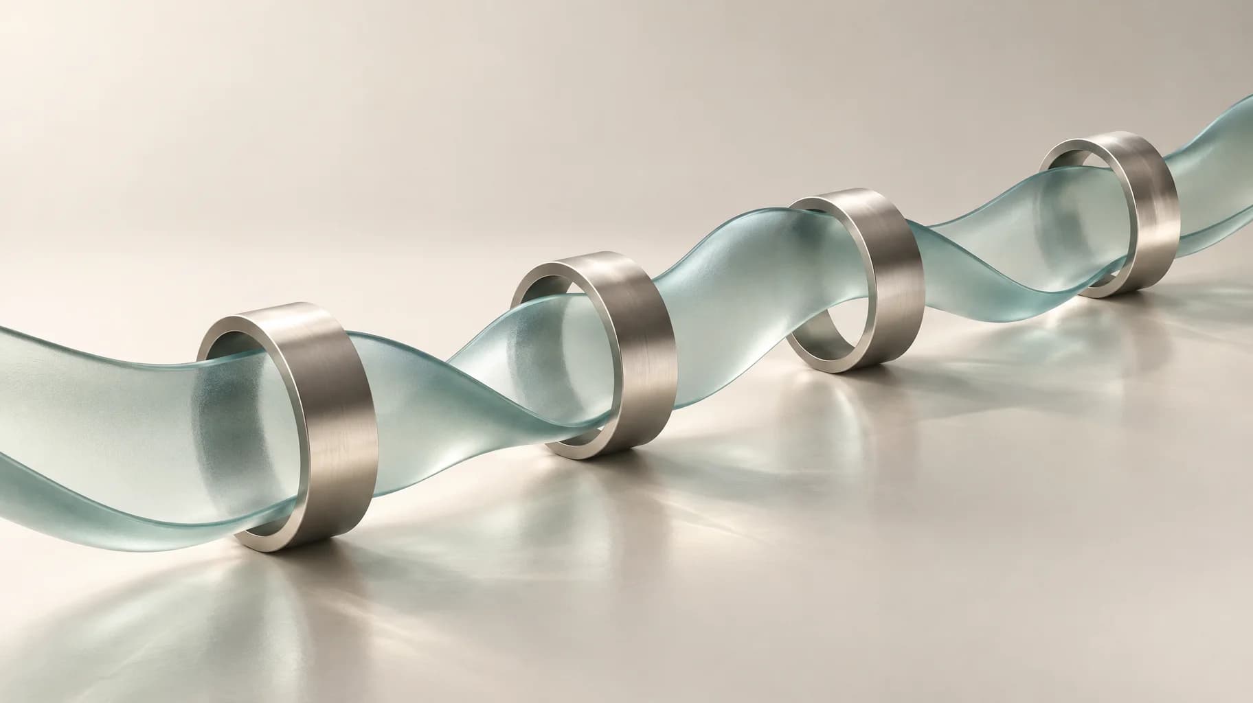 An undulating glass ribbon passes through four evenly spaced metal collars, each leaving room around the ribbon.